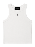 MONUMENTS MM cropped tank top in white cotton-spandex with a black MONUMENTS neck tab and MM chest mark, front view.