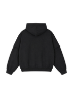 Back of the MONUMENTS raw-edge oversized hoodie in washed black heavyweight cotton.