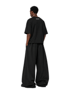 Back of the MONUMENTS MM core logo cropped boxy tee in black cotton.