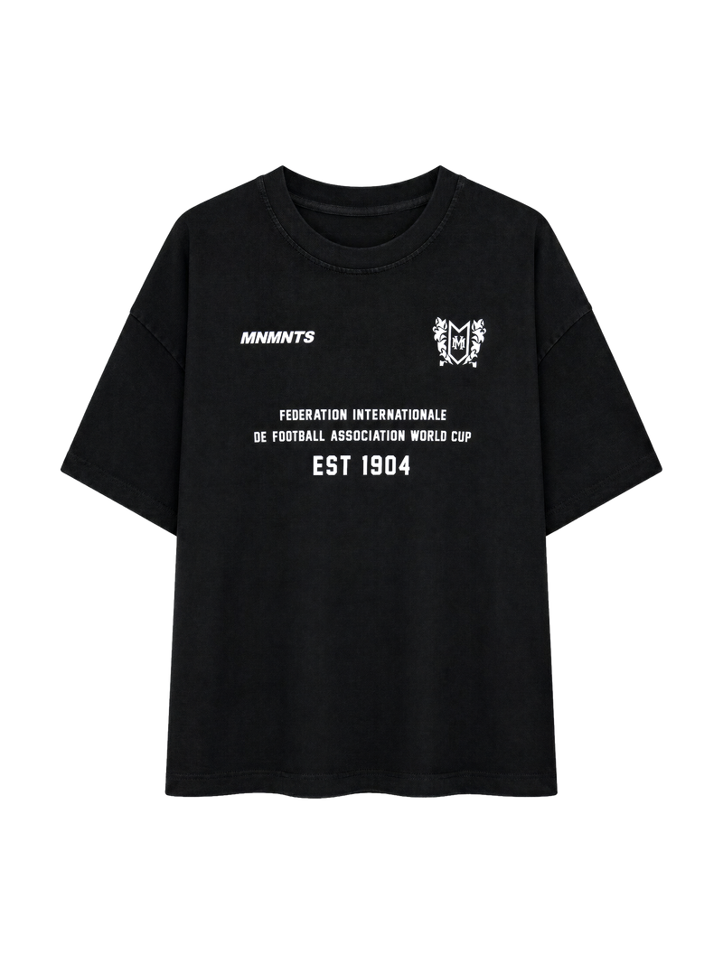 MONUMENTS 1904 World Cup oversized tee in black cotton jersey with bonded 1904 Federation front artwork, front view.
