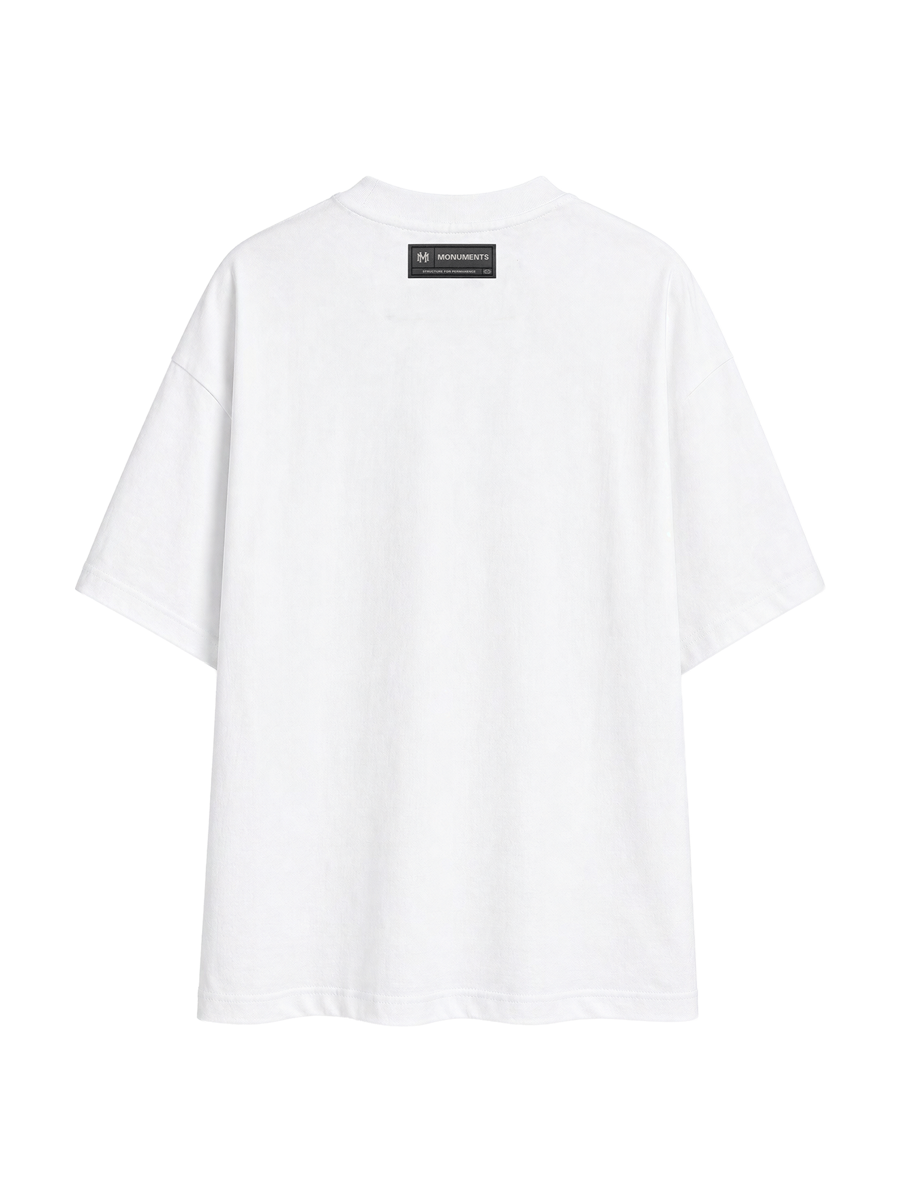 Back of the white MONUMENTS 414 Structure oversized tee showing the woven MONUMENTS label.